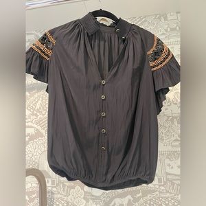 Ramy Brook black silk top with feminine embroidered detail on cap sleeve